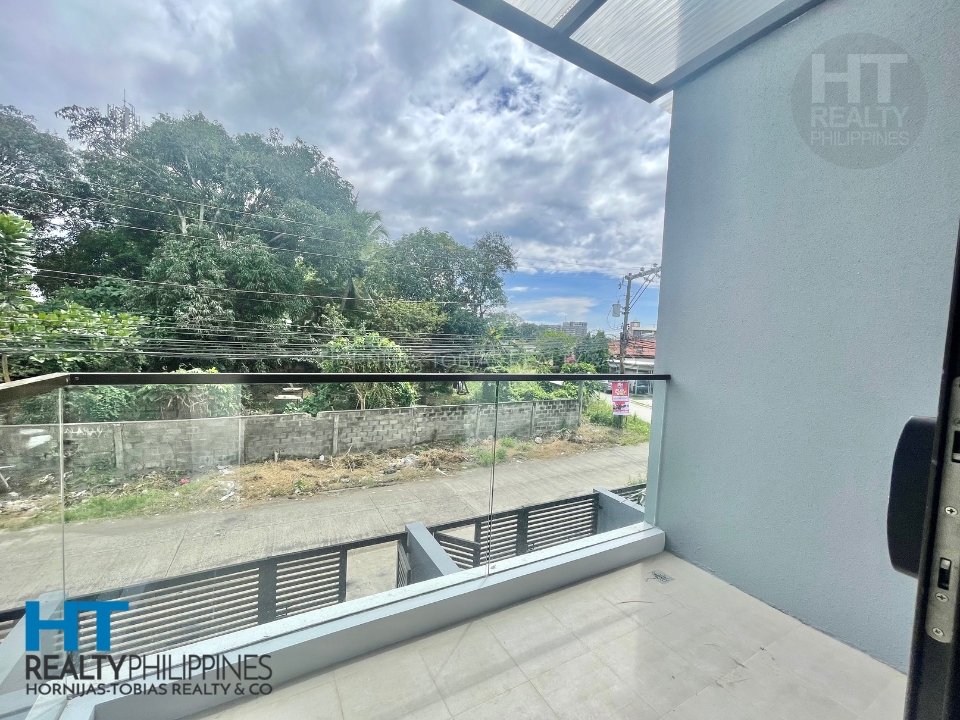 Balcony Primary Master Bedroom - Brand New Move-In Ready 3-Level Townhouse in Damosa Business District, Lanang