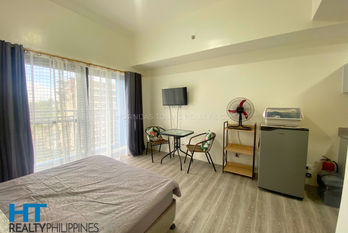 Bed - Furnished studio condo for sale in Amani Grand City Gate, Buhangin-Cabantian-Indangan Rd, Buhangin, Davao City